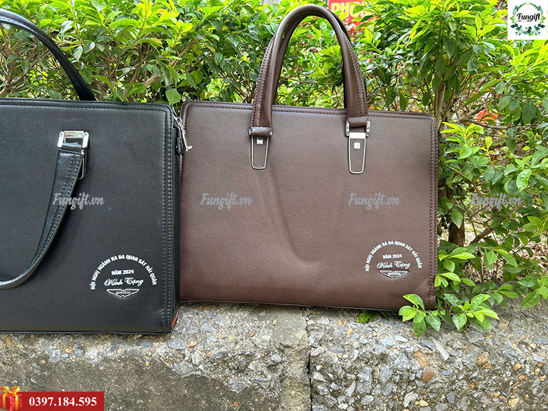 Xưởng may cặp da in logo đại hội theo yêu cầu